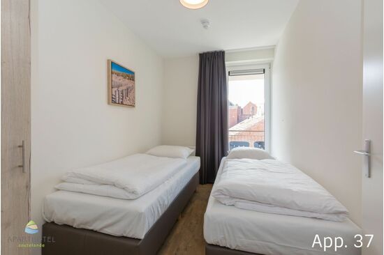 Slaapkamer met aparte bedden