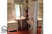 Bathroom with washing machine and dryer