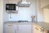 Fitted kitchen with combination microwave