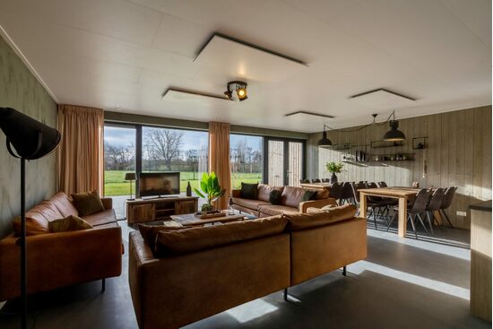 living room gives access to the terrace through the French doors