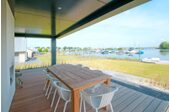 Open veranda holiday home on the water